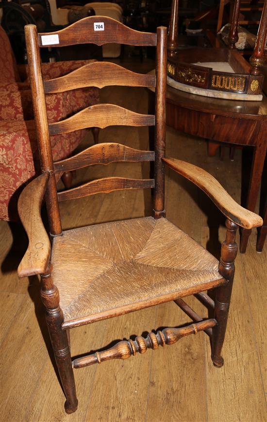 A County rush seat ladderback elbow chair, and two others
